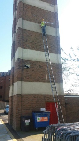 Displaying 3 Story Reach Capability man on ladder